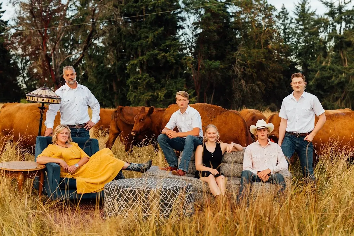 Pacific Cascade Farms 2022 Family Portrait sitting on a couch in a field